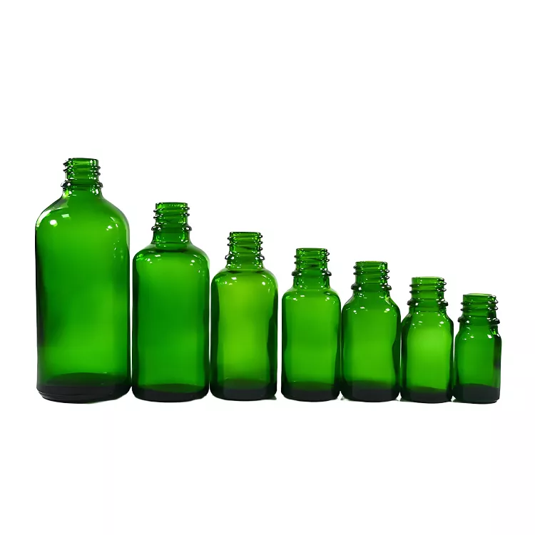 Green essential oil bottle in bulk