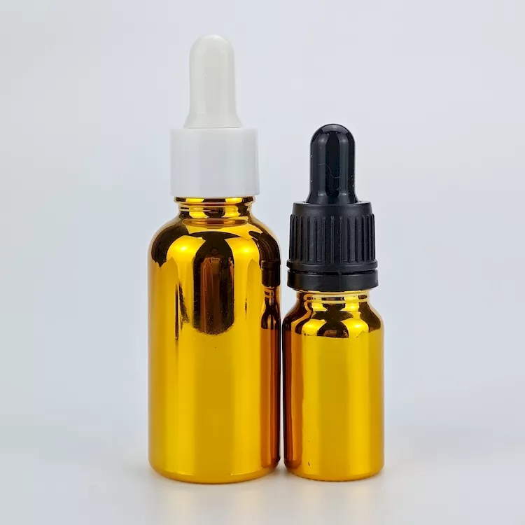 Golden essential oil bottle with dropper
