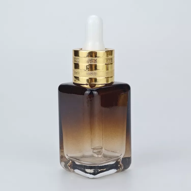 Cosmetic bottle with dropper cap