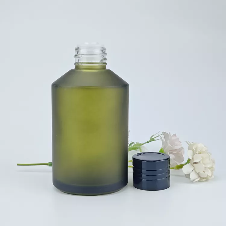 Green glass cosmetic bottle